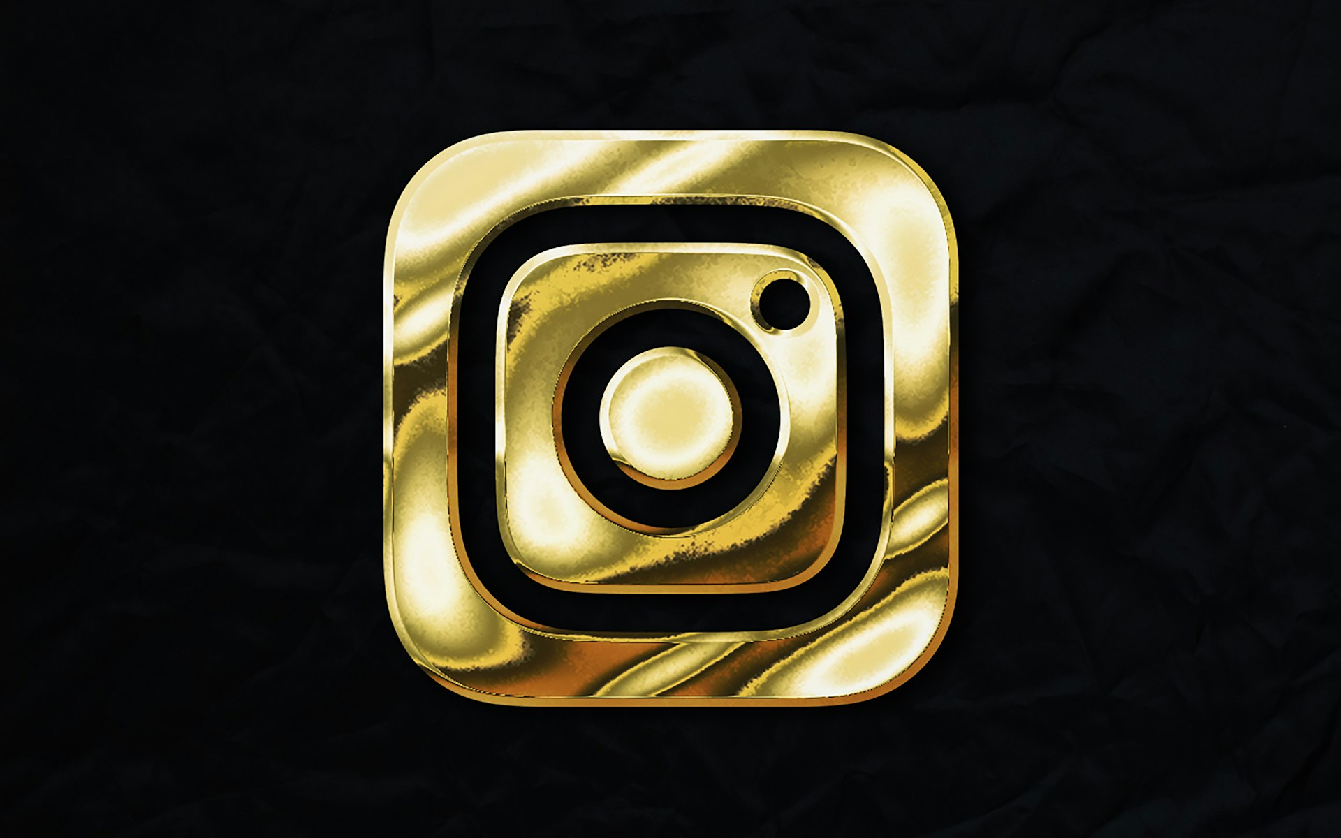 a gold instagram logo on a black background